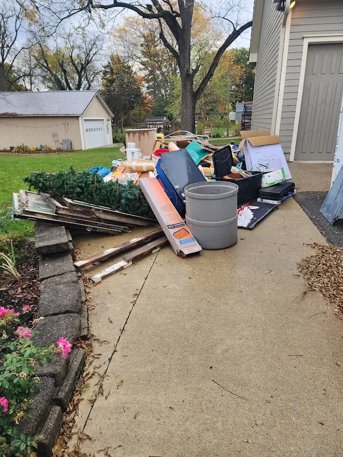 Dumpster being loaded with debris for Demolition Dumpster Rental in Bull Run